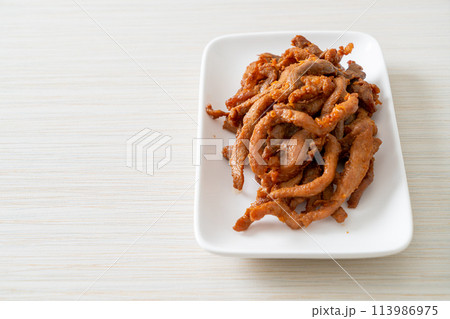 Sun-Dried Pork on white plate 113986975