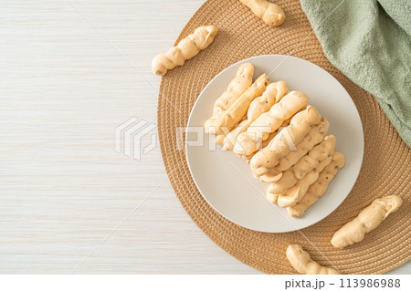 almonds meringue stick on plate 113986988