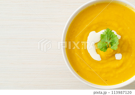 pumpkin soup in white bowl pumpkin soup in white bowl 113987120
