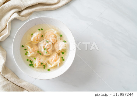 shrimp dumpling soup in white bowl 113987244
