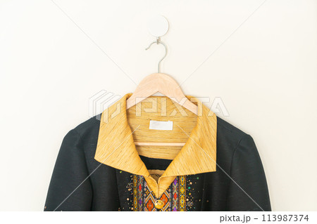 beautiful woman shirt hanging on wall 113987374