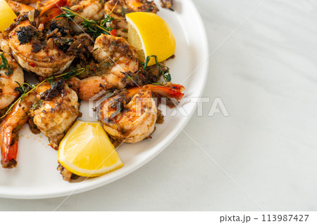 jerk shrimps or grilled shrimps in Jamaica style 113987427