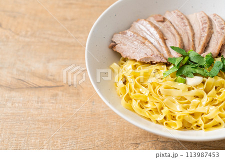 dried duck noodles in white bowl 113987453
