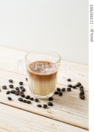 Dirty coffee, cold milk topped with hot espresso coffee shot 113987665