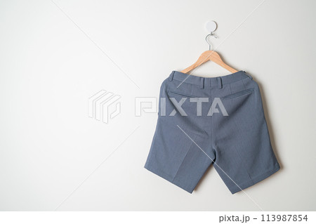 short pants hanging on wall 113987854