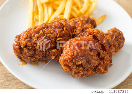 spicy Korean fried chicken with fries 113987855