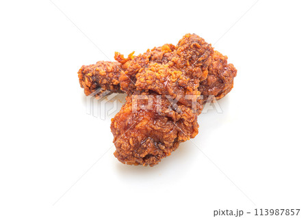 fried chicken with spicy Korean sauce on white background fried chicken with spicy Korean sauce on white background 113987857