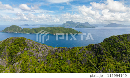 Tropical landscape of Islands and blue sea. Blue sky and clouds. El Nido, Philippines. 113994149