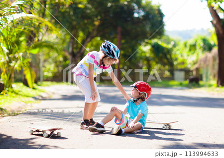 Kids with skate board. Skateboard fall and injury. Kids with skate board. Skateboard fall and injury. 113994633