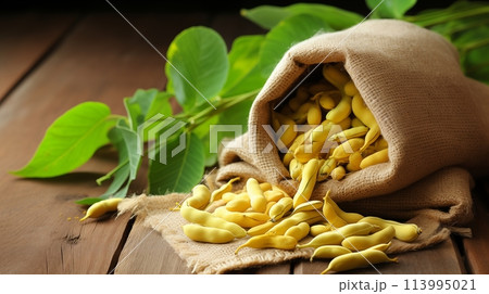 Yellow beans spill from a rustic sack.AI Generated Yellow beans spill from a rustic sack.AI Generated 113995021