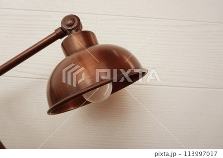 close up of metal desk lamp with space copy on concreat background home interier decoration close up of metal desk lamp with space copy on concreat background home interier decoration 113997017