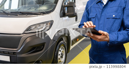 Manager with a digital tablet on the background of delivery van. Fleet management 113998804