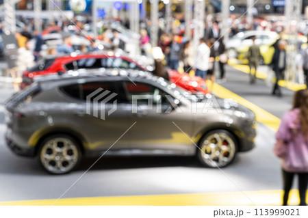 Blurred background of car show exposition. Blurred background of car show exposition. 113999021