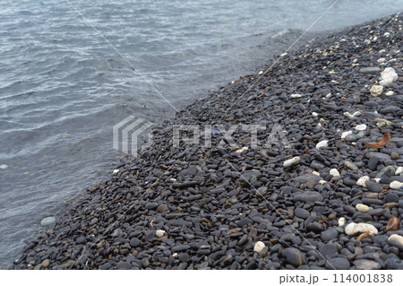 Granite gravel stone rocks flooring pattern surface texture on sea lake. Close-up of exterior material for design decoration background. Rubble 114001838
