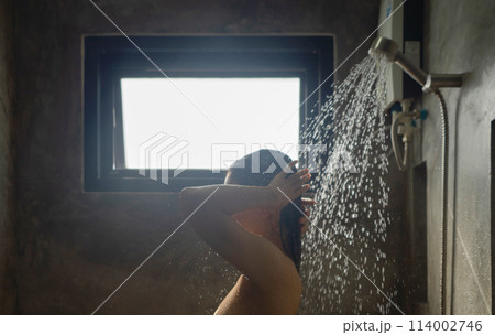 A woman taking a shower at home. People lifestyle. A woman taking a shower at home. People lifestyle. 114002746