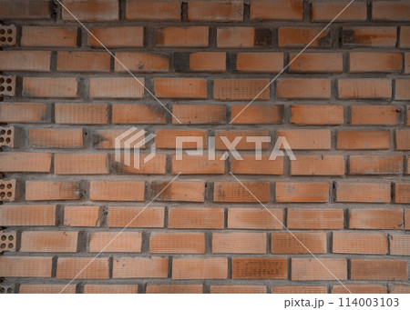 Brick wall pattern surface texture. Close-up of interior material for design decoration background 114003103