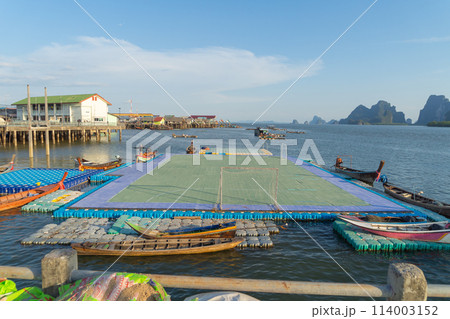 Koh Panyee, The Floating village urban city town houses, lake sea or river. Nature landscape fisheries and fishing tools at Pak Pha, Phang Nga, Thailand. Aquaculture farming 114003152