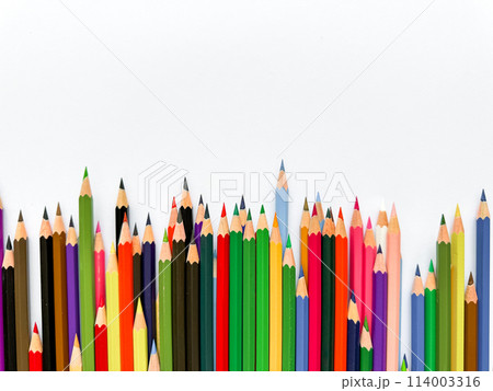 Assorted colored pencils lined up on white background with space for text. Creative concept for art, education, and design advertising banner for school products with empty space. 114003316