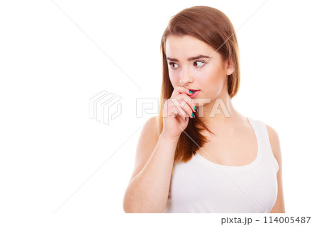 Teenage woman looking worried, thinking about something Teenage woman looking worried, thinking about something 114005487