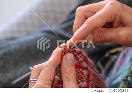 Women's hands knit socks from yarn. Knitting socks is a great activity for women.2 114005858