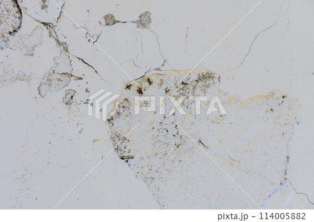 Ancient wall with peeling plaster. Old concrete wall, panoramic textured background Ancient wall with peeling plaster. Old concrete wall, panoramic textured background 114005882
