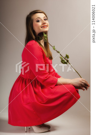 Fashion woman teen girl in red gown with dry rose. Fashion woman teen girl in red gown with dry rose. 114006021