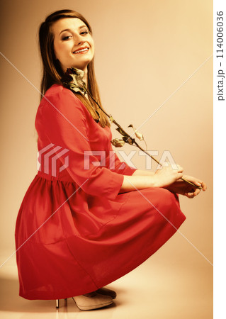 Fashion woman teen girl in red gown with dry rose. 114006036
