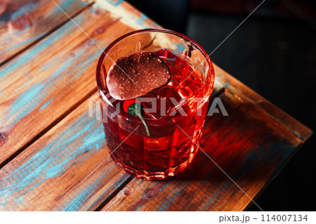 Alcoholic drink. A cocktail with elite alcohol on dark black background 114007134