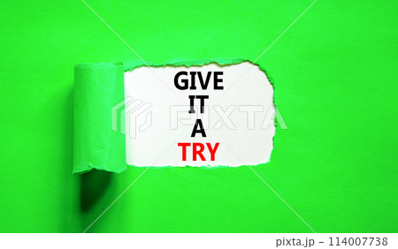 Give it a try symbol. Concept word Give it a try on beautiful white paper. Beautiful green paper background. Business give it a try concept. Copy space. Give it a try symbol. Concept word Give it a try on beautiful white paper. Beautiful green paper background. Business give it a try concept. Copy space. 114007738