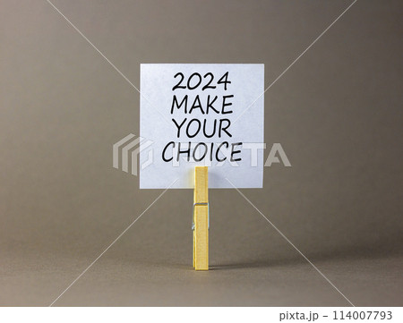 2024 Make your choice symbol. Concept words 2024 Make your choice on beautiful white paper on clothespin. Beautiful grey background. Business 2024 Make your choice concept. Copy space 2024 Make your choice symbol. Concept words 2024 Make your choice on beautiful white paper on clothespin. Beautiful grey background. Business 2024 Make your choice concept. Copy space 114007793