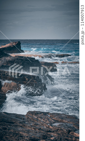 Sea waves break upon rocks Sea waves break upon rocks 114007913