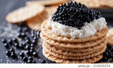 crackers topped with creamy cheese and adorned with black caviar, Ai Generated. 114010254