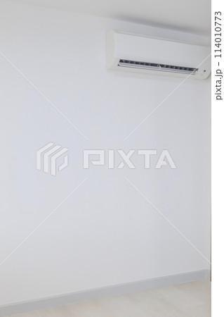 air conditioner on a white wall in the interior of a child's bedroom. air conditioner on a white wall in the interior of a child's bedroom. 114010773