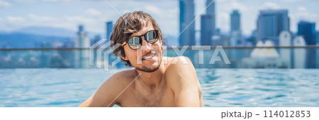 Man relax in swimming pool in sunrise, on rooftop in the city. Rich people BANNER, LONG FORMAT Man relax in swimming pool in sunrise, on rooftop in the city. Rich people BANNER, LONG FORMAT 114012853