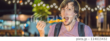 Young man tourist on Walking street Asian food market BANNER, LONG FORMAT 114013432