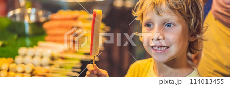 Young boy tourist on Walking street Asian food market BANNER, LONG FORMAT 114013455