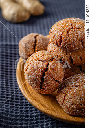 Warm Homemade Gingersnap Cookies on a gray handkerchief 114014220