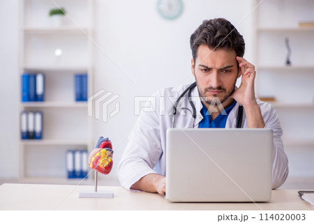Young male doctor in telemedicine concept Young male doctor in telemedicine concept 114020003