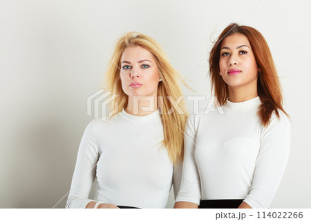Two young friends together. 114022266