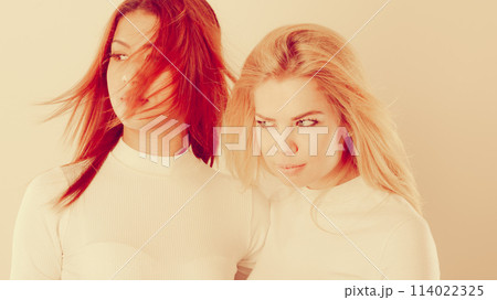 Two young friends together. 114022325