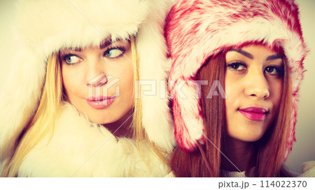 Two girls with winter outfit. Two girls with winter outfit. 114022370