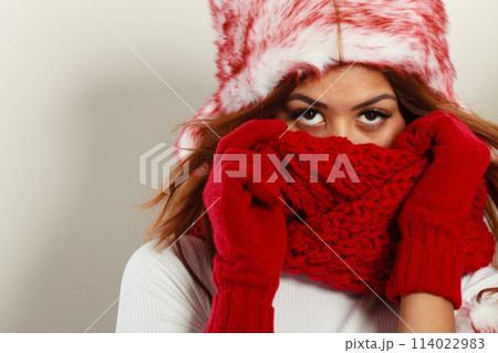 Woman with red winter clothing. 114022983