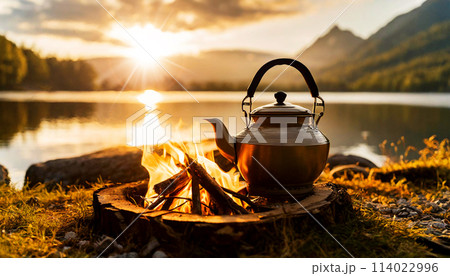 Peaceful Cozy Campfire with a Vintage Teapot and Beautiful Lake at Sunset - Generative Ai 114022996