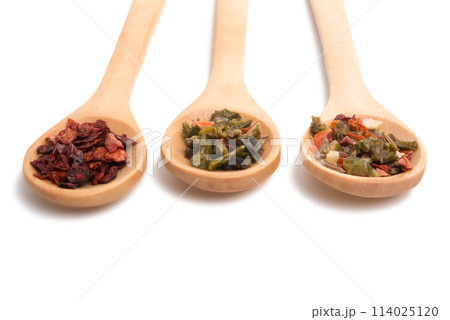 wooden spoon filled with various spices isolated on the white 114025120