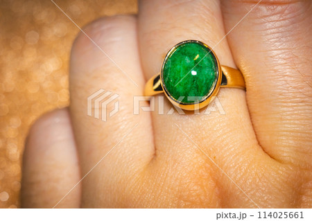 Gold ring with green stone Gold ring with green stone 114025661