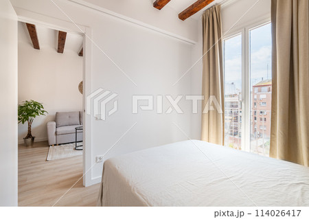 View on living room through open bedroom door 114026417