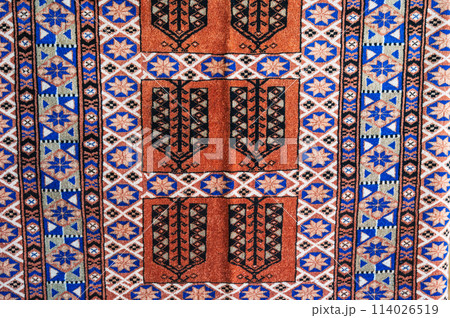 pattern of a traditional Arab carpet at oriental bazaar in Tashkent in Uzbekistan in close-up pattern of a traditional Arab carpet at oriental bazaar in Tashkent in Uzbekistan in close-up 114026519
