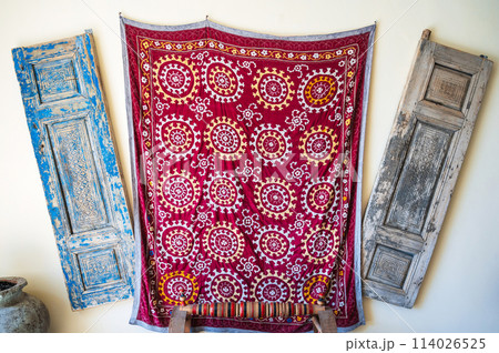 red vintage oriental Arabic carpets on wall in Uzbekistan red vintage oriental Arabic carpets on wall in Uzbekistan 114026525
