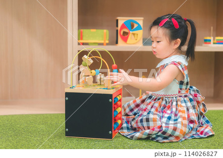 Asian girl play education toy at kindergarten preschool. Development chlidhood. 114026827