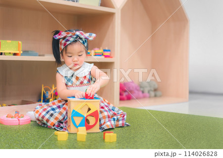 Asian girl play education toy at kindergarten preschool. Development chlidhood. Asian girl play education toy at kindergarten preschool. Development chlidhood. 114026828